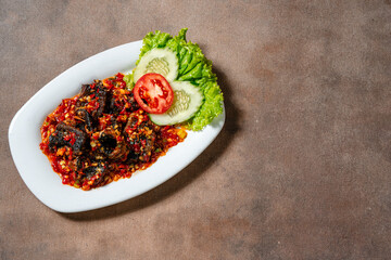 Fried eel or belut goreng with sambal balado is a Indonesian traditional food 