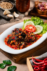 Fried eel or belut goreng with sambal balado is a Indonesian traditional food 
