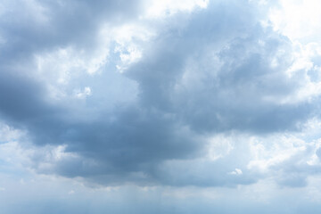 Obraz premium Beautiful fluffy white clouds drift across a clear blue sky