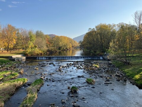 Autumn landscape by the river in the mountains