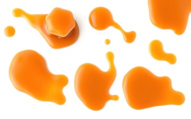 Caramel sauce drizzled on a white surface with a caramel candy