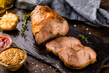 Delicious grilled chicken breast with potatoes, tomatoes, and rosemary