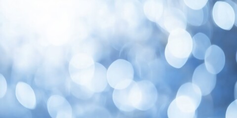 Obraz premium Soft Blue Blurred Background with Light Bokeh Effects Ideal for Presentation and Creative Projects Featuring Gentle Abstract Patterns