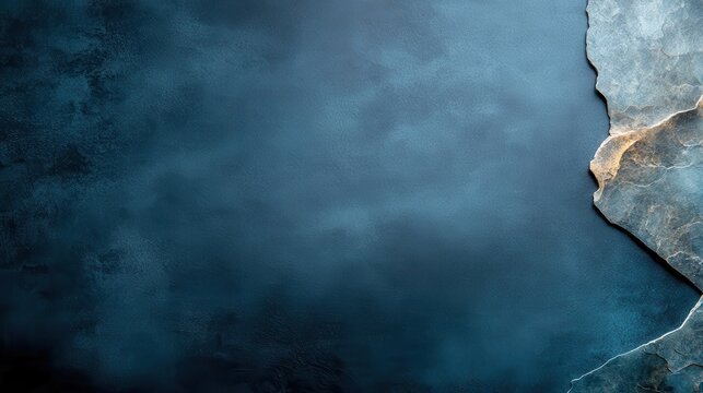 An elegant image showcasing a textured blue background with a rugged tidemark, evoking feelings of calmness, stability, and understated sophistication.