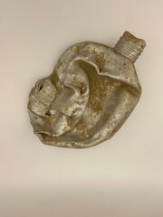 crushed metal bottle