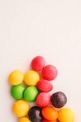 Chocolate round candies scattered on white isolated background