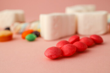 Assortment of sweets on a soft pink background, banner, advertising