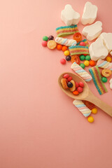 Obraz premium Assortment of sweets on a soft pink background, banner, advertising