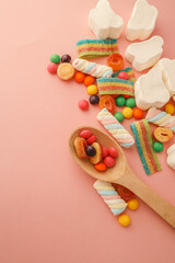 Assortment of sweets on a soft pink background, banner, advertising