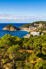 Fototapeta premium Bay of Tossa de Mar with the old town’s fortified walls and white facades