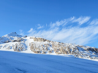 Obraz premium Ski resort Hintertux glacier, Austria in the snow cowered mountains on a sunny day.