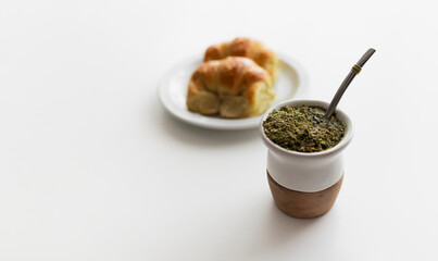 A popular breakfast in Argentina: Yerba mate, a type of strong green tea, and argentinian croissants called medialunas