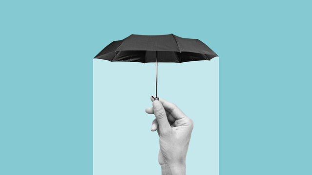 Hiding under an umbrella from problems symbolizing insurance, support and protection. The concept of protection of health and wealth. Copy space