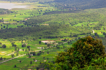 Obraz premium Panoramic nature background from a viewpoint on a high mountain overlooking the scenery below, river, road, rocks, trees, the beauty of nature during a trip in Khon Kaen, Thailand.