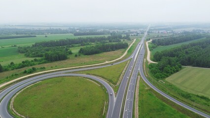 Overhead image of multi-lane highway crossing and fields
