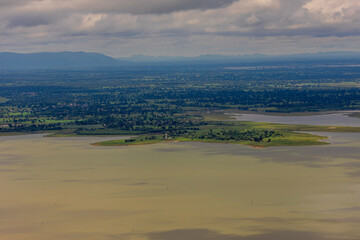 Panoramic nature background from a viewpoint on a high mountain overlooking the scenery below, river, road, rocks, trees, the beauty of nature during a trip in Khon Kaen, Thailand.