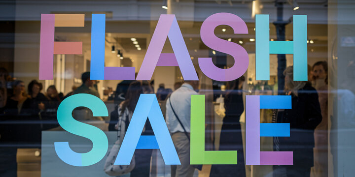 Flash Sale Storefront Display with Large Multicolored Text on Glass Window

 - Powered by Adobe