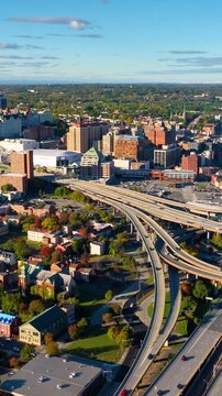 Aerial view of the Interstate 787 and South Mall Arterial interchange in downtown Albany in autumn. Vertical video.