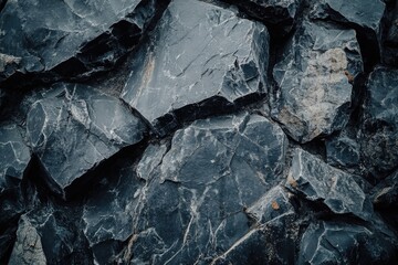 A close-up view of a pile of black rocks