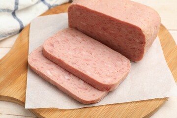 Tasty canned meat on light table, closeup