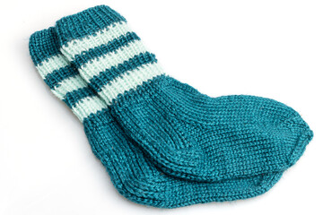 Warm, woolen knitted socks isolated on white background. Warm socks made of wool for winter season. 