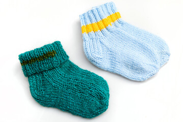 Warm, woolen knitted socks isolated on white background. Warm socks made of wool for winter season. 