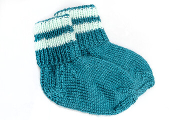 Warm, woolen knitted socks isolated on white background. Warm socks made of wool for winter season. 