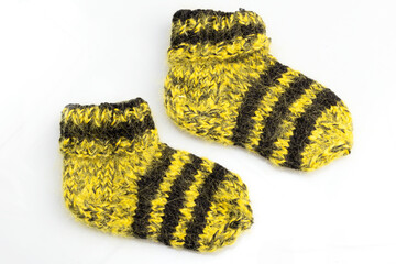 Warm, woolen knitted socks isolated on white background. Warm socks made of wool for winter season. 