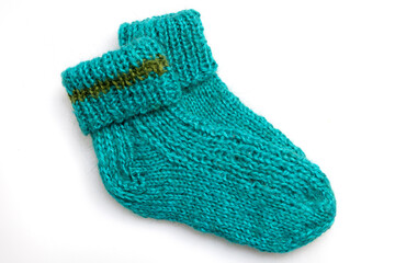 Warm, woolen knitted socks isolated on white background. Warm socks made of wool for winter season. 