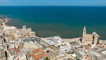 Naklejka premium Aerial view of the Swabian Castle and the cathedral basilica of Santa Maria Assunta, commonly known as San Nicola Pellegrino, located in Trani, Puglia, Italy. They are the main attractions of the city