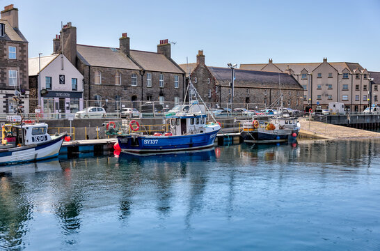 Orkney, Scotland - August 6, 2024: The marina, waterfront shops and buildings in the town of Kirkwall on the island of Orkney in Scotland
