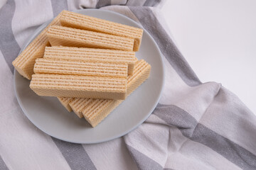 Waffles on a colored background. Sweet dessert. Nutrition concept. Tasty sweets