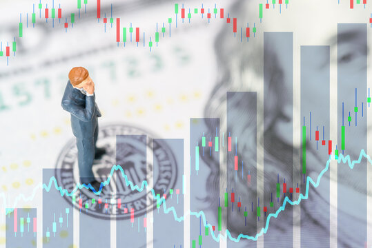 Businessman stands on USD note over fed logo depicting currency exchange of global trade forex. Fed increase or decrease interest rate to manage inflation and sometimes remain higher for longer.
