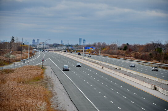 Ontario, Canada, November 8, 2024: Traffic and road signs on Highway 407 near Markham, Ontario. The 407 ETR is an express toll route highway owned by the 407 International Inc.