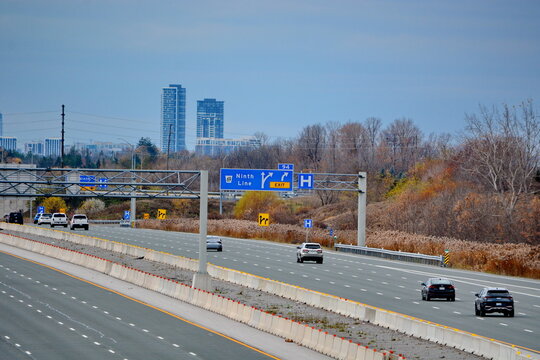 Ontario, Canada, November 8, 2024: Traffic and road signs on Highway 407 near Markham, Ontario. The 407 ETR is an express toll route highway owned by the 407 International Inc.