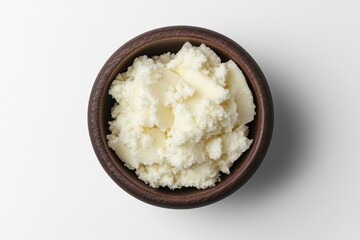 Butter in wooden bowl, creamy texture, smooth appearance