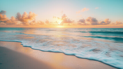 Obraz premium A picturesque beach scene at sunrise with calm waves lapping on the shore.