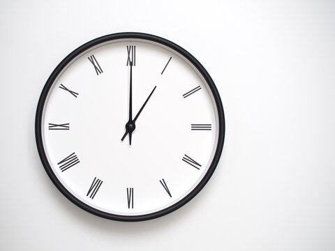 Clock Showing 13.00/01.00 with Roman Numerals &ndash; Simple Round Clock for Concepts of Time Management and Scheduling.