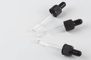 Pipettes with liquid on a white background