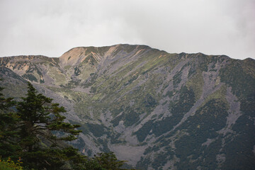 Obraz premium Mountain peaks in cloudy highland areas