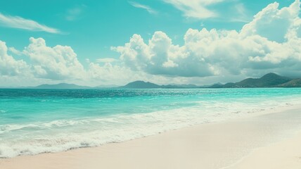 Obraz premium Scenic tropical beach with clear water and distant hills under bright sky Serene peaceful atmosphere
