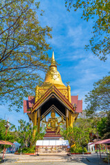 Fototapeta premium Golden four face Buddha statue on pedestal