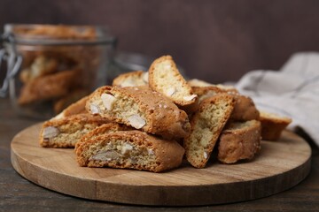 Traditional Italian almond biscuits (Cantucci) on wooden table, closeup