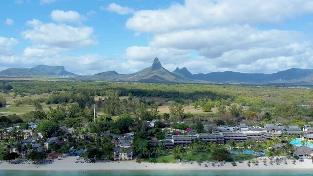 Aerial view of gorgeous Rempart mountain from Flic en Flac beautiful tropical beach, Mauritius island, Africa
