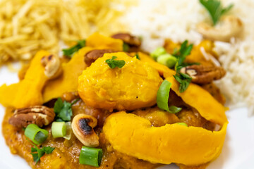 Traditional and exotic Brazilian dish rice, chicken and pequi (caryocar brasileinse) 