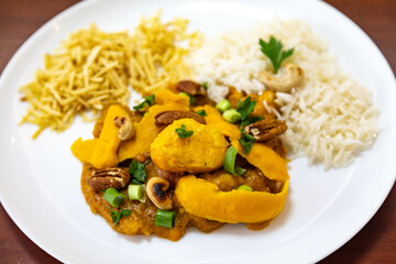 Traditional and exotic Brazilian dish rice, chicken and pequi (caryocar brasileinse) 