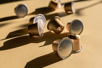 Coffee capsules in natural light against a light background