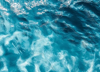 Obraz premium Abstract Texture of Rippling Turquoise Water with Glimmering Sunlight Reflections