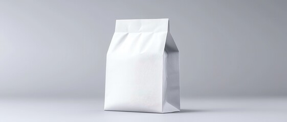 A plain white bag, slightly crinkled, stands against a minimalist gray background, emphasizing its simple design and packaging.