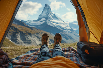 Fototapeta premium Cozy moments inside a tent, enjoying nature with stunning mountain views